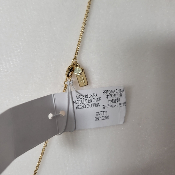 Kate Spade gold tone necklace with shiny bow charm - Picture 3 of 4